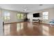 Open-concept living area featuring wood floors, neutral walls and lots of natural light at 11521 E Quintana Ave, Mesa, AZ 85212