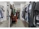 Spacious walk-in closet with ample storage, featuring organized shelving and hanging space at 11521 E Quintana Ave, Mesa, AZ 85212