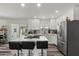 Bright modern kitchen with an island, stainless steel appliances, and beautiful pendant lighting at 1321 W 14Th St, Tempe, AZ 85281