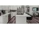 Contemporary kitchen with an island, stainless steel appliances, and stylish bar stool seating at 1321 W 14Th St, Tempe, AZ 85281