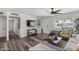 Bright living room with hardwood floors, ceiling fan, and a comfortable seating arrangement at 1321 W 14Th St, Tempe, AZ 85281