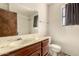 This bathroom features a vanity and shower at 136 E San Angelo Ave, Gilbert, AZ 85234