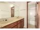 Bathroom featuring double sinks and shower at 136 E San Angelo Ave, Gilbert, AZ 85234