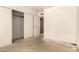 Bedroom with carpet, closet with folding doors, neutral walls, and access to other rooms at 136 E San Angelo Ave, Gilbert, AZ 85234