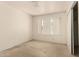 Empty bedroom with carpet, a window, and neutral walls offering a blank canvas for personalization at 136 E San Angelo Ave, Gilbert, AZ 85234