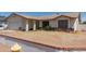 Traditional-style home with a two-car garage, neutral paint, and a low brick wall at 136 E San Angelo Ave, Gilbert, AZ 85234