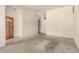 Open living room with a neutral color palette and tile flooring at entry at 136 E San Angelo Ave, Gilbert, AZ 85234