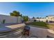 Spacious backyard features a stock tank pool, lush grass area, and outdoor seating at 13614 N 38Th Pl, Phoenix, AZ 85032