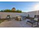 Relaxing backyard featuring a stock tank pool and lounge chairs, perfect for outdoor living at 13614 N 38Th Pl, Phoenix, AZ 85032