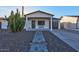 Charming single-story home with a desert landscape and a cozy front porch at 13614 N 38Th Pl, Phoenix, AZ 85032