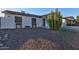 Well-maintained front yard with desert landscaping and a charming single-story house at 13614 N 38Th Pl, Phoenix, AZ 85032