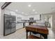 Modern kitchen features stainless steel appliances, white cabinets, and a butcher block island at 13614 N 38Th Pl, Phoenix, AZ 85032