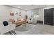 Bright living room featuring neutral colors, modern furnishings, and decorative wall art at 13614 N 38Th Pl, Phoenix, AZ 85032