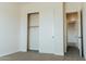 Bedroom featuring carpet floors, closet with sliding doors, and white trim at 1623 E Hidalgo St, Apache Junction, AZ 85119