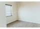 Bedroom showcasing a window with blinds, neutral paint, and carpeted flooring at 1623 E Hidalgo St, Apache Junction, AZ 85119