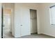Bedroom featuring carpet floors, closet with sliding doors, and neutral walls at 1623 E Hidalgo St, Apache Junction, AZ 85119
