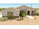 Inviting single-story home boasting desert landscaping, stone details, and a durable tile roof at 1623 E Hidalgo St, Apache Junction, AZ 85119