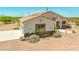Attractive single-story house showcasing stone veneer, desert landscaping, and a sturdy tile roof at 1623 E Hidalgo St, Apache Junction, AZ 85119