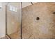Tile shower with glass enclosure at 1623 E Hidalgo St, Apache Junction, AZ 85119