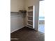 This walk-in closet provides built-in shelving and adjoins the bathroom at 1623 E Hidalgo St, Apache Junction, AZ 85119