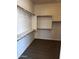 The walk-in closet includes built-in wooden shelving and carpeted floors at 1623 E Hidalgo St, Apache Junction, AZ 85119