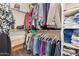 Walk-in closet with ample storage space and well-organized clothing racks at 16259 W Papago St, Goodyear, AZ 85338