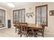 Bright dining room with a wooden table, chairs, and abundant natural light at 16259 W Papago St, Goodyear, AZ 85338