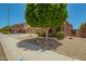 Neighborhood street with desert landscaping and sidewalks, showcasing a suburban neighborhood at 16259 W Papago St, Goodyear, AZ 85338
