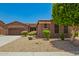 Charming single-Gathering home boasts desert landscaping, a two-car garage, and a cozy, inviting facade at 16259 W Papago St, Goodyear, AZ 85338