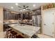 Stylish kitchen featuring stainless steel appliances, a granite island, and custom cabinetry at 16259 W Papago St, Goodyear, AZ 85338