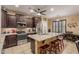 Modern kitchen featuring granite countertops, stainless steel appliances, and a breakfast bar at 16259 W Papago St, Goodyear, AZ 85338
