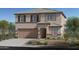 Stunning two-story home with a neutral color scheme, attached garage, and desert landscaping in a desirable community at 18244 W Tohono Dr, Goodyear, AZ 85338