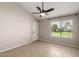 Bedroom with a ceiling fan and neutral paint, and a window with blinds offering natural light at 19601 N 7Th St # 1022, Phoenix, AZ 85024