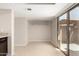 Bonus room with light tile flooring and sliding glass door leading to an outdoor area with privacy wall at 19601 N 7Th St # 1022, Phoenix, AZ 85024