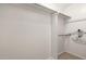 Walk-in closet offering ample storage space with built-in shelving, and bars for hanging clothing at 19601 N 7Th St # 1022, Phoenix, AZ 85024