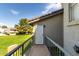 View from the balcony, showcasing outdoor community green space, with a safety door at 19601 N 7Th St # 1022, Phoenix, AZ 85024