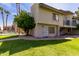 Charming condo featuring a secure entrance, green grass, and refreshing pool access for a comfortable lifestyle at 19601 N 7Th St # 1022, Phoenix, AZ 85024