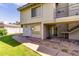 Well-maintained two-story apartment exterior with a private walk-out patio and green grass at 19601 N 7Th St # 1022, Phoenix, AZ 85024