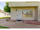 Inviting entrance with security door, brick accents, and view into window at 19601 N 7Th St # 1022, Phoenix, AZ 85024
