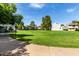 Lush green space view showcases outdoor community lawn with mature trees at 19601 N 7Th St # 1022, Phoenix, AZ 85024