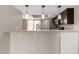 Charming breakfast bar overlooking the kitchen, complete with stylish pendant lighting and modern fixtures at 19601 N 7Th St # 1022, Phoenix, AZ 85024