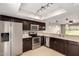 Bright kitchen showcases stainless steel appliances, dark cabinets, and stylish pendant lighting at 19601 N 7Th St # 1022, Phoenix, AZ 85024