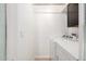 Bright laundry area with washer and dryer, white walls, and convenient shelving at 19601 N 7Th St # 1022, Phoenix, AZ 85024