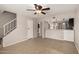 Open living area featuring staircase, kitchen access, and tile flooring for easy maintenance at 19601 N 7Th St # 1022, Phoenix, AZ 85024