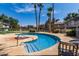 Refreshing pool with clear blue water surrounded by palm trees and well-maintained landscaping at 19601 N 7Th St # 1022, Phoenix, AZ 85024