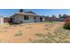 Backyard view features a covered patio and low-maintenance landscaping at 2233 W Oraibi Dr, Phoenix, AZ 85027