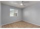 Charming bedroom offering a ceiling fan and a large window to let the natural light in at 2233 W Oraibi Dr, Phoenix, AZ 85027