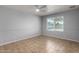 Bedroom with window and tiled floor. Neutral paint and ceiling fan at 2233 W Oraibi Dr, Phoenix, AZ 85027