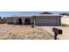 Charming single-story home with a well-maintained front yard and a two-car garage at 2233 W Oraibi Dr, Phoenix, AZ 85027