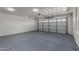 Well-maintained garage offering a white door and painted floor at 2233 W Oraibi Dr, Phoenix, AZ 85027
